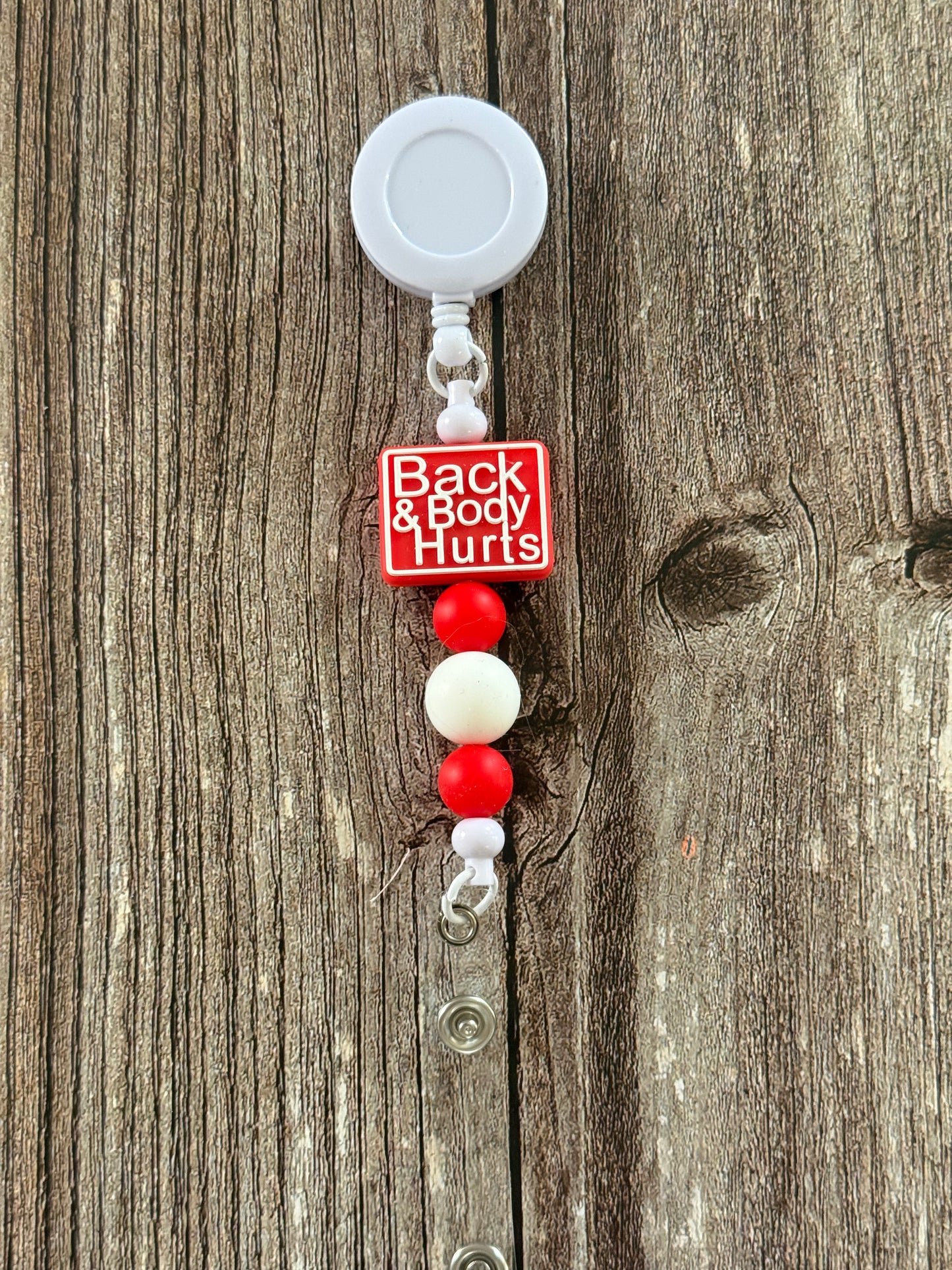 Back and Body Hurts Badge Reel